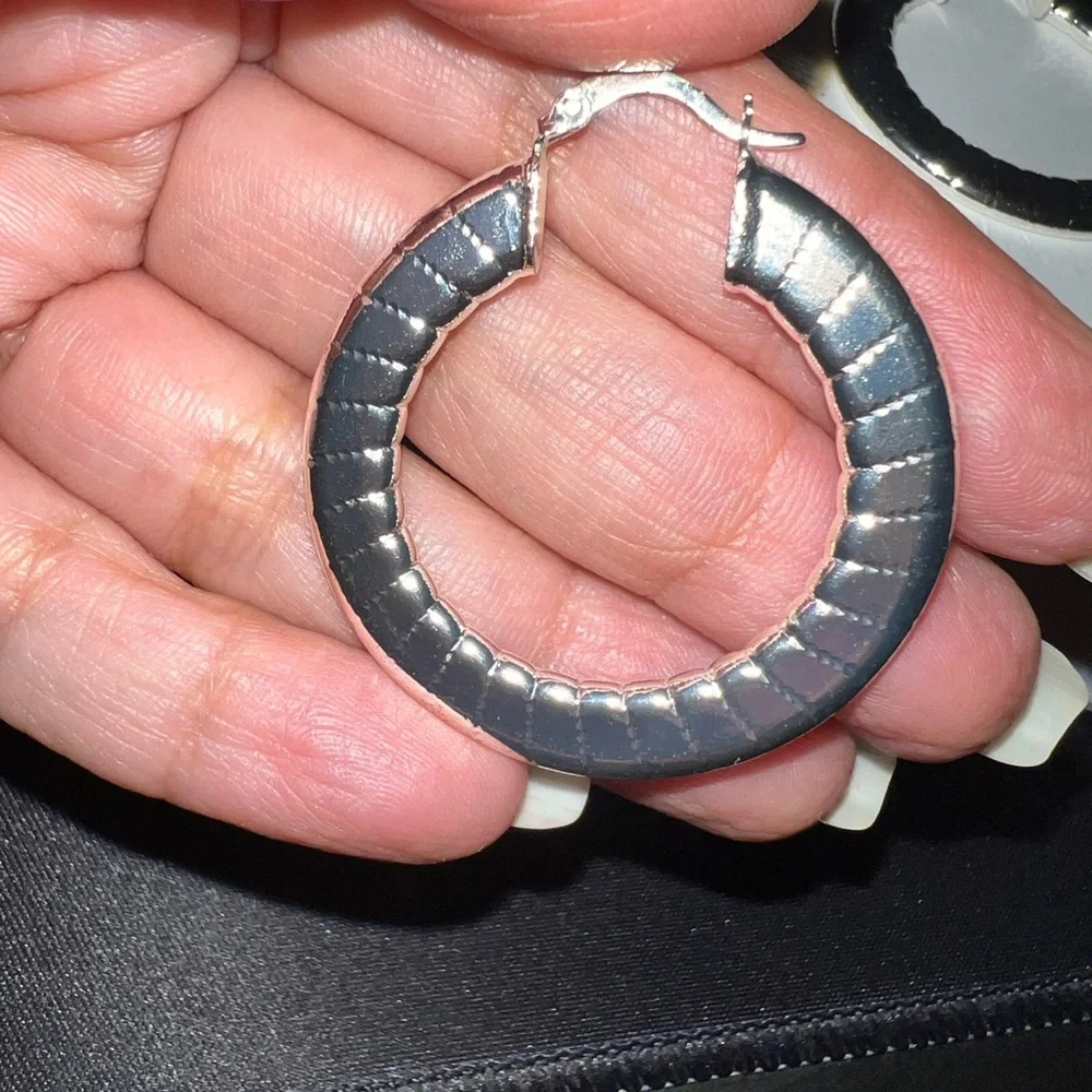 Shiny silver tone hoop earrings 2” length‎